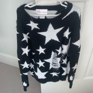 black and white ripped star sweater